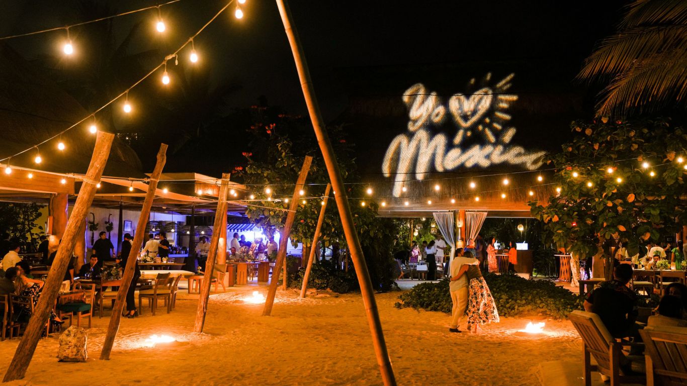 Zapote Bar team cheering and enjoying the preparation of a drink